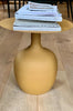 Small amber coloured metal side table with flat top